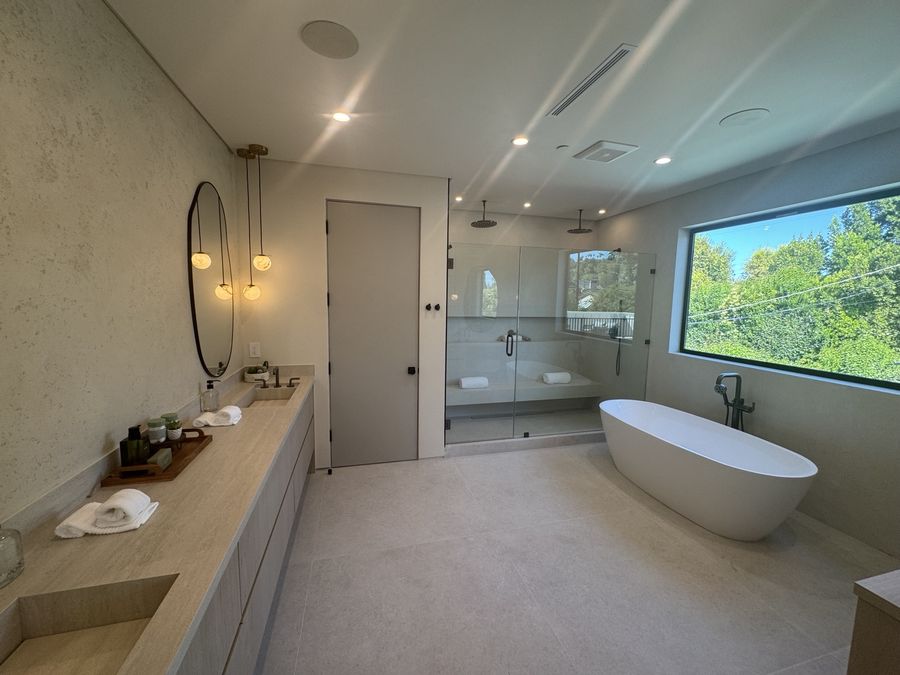 Primary bathroom renovation with tub and shower by Coastline DC