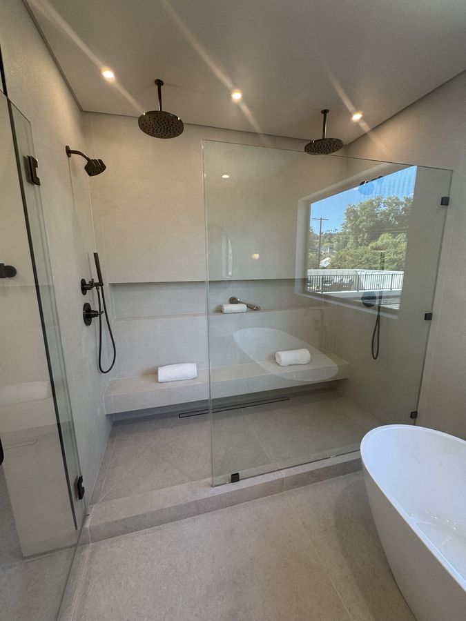 Custom glass walk-in shower by Coastline DC