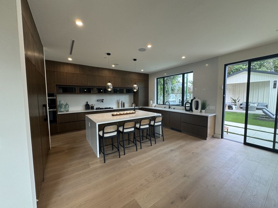 Modern kitchen with waterfall island by Coastline DC