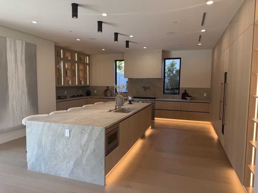 Illuminated stone kitchen island by Coastline DC