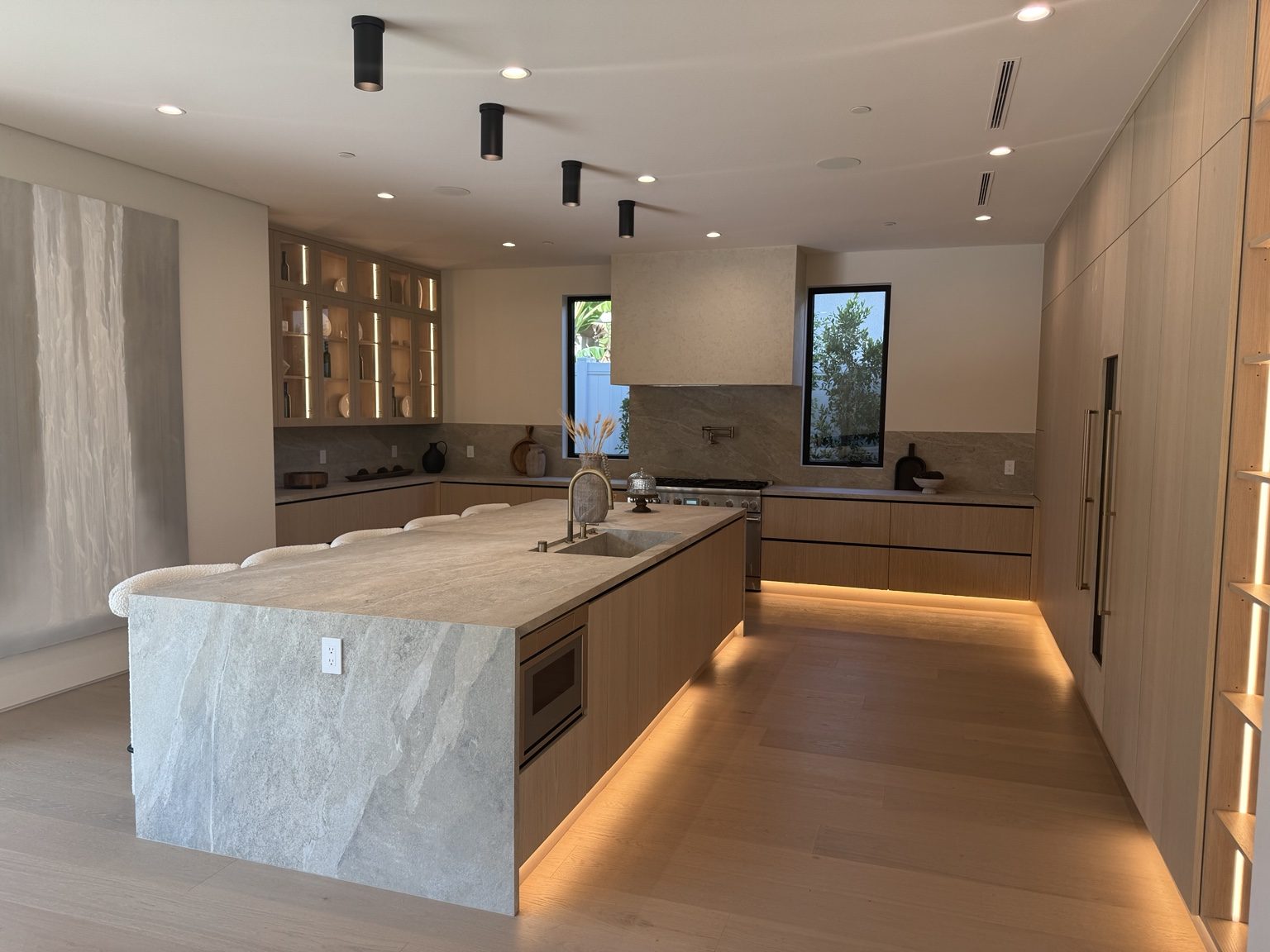 Illuminated stone kitchen island by Coastline DC