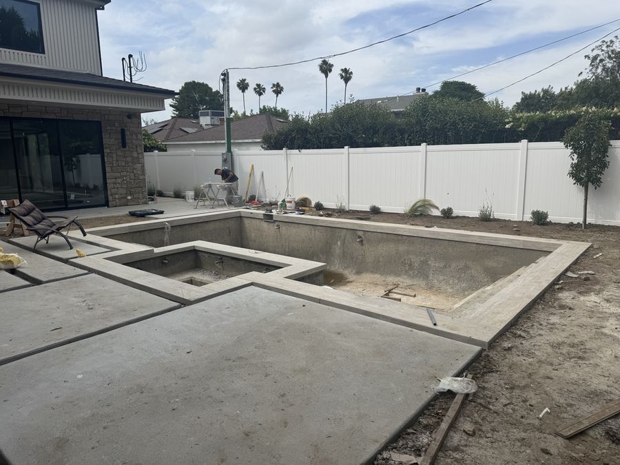 Pool construction with finished decking by Coastline DC